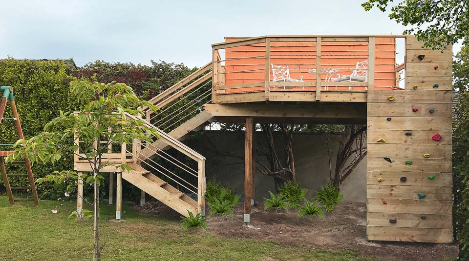 Elevated sea view entertaining deck with climbing wall, a unique structure for all ages